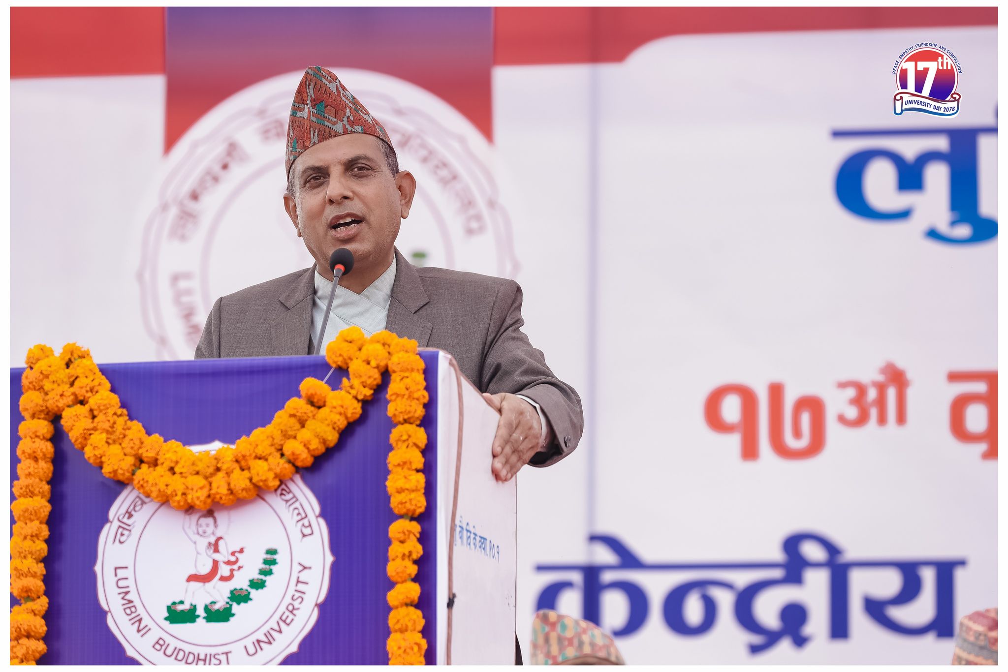 Dr. Tilak Ram Acharya speaking at Lumbini Buddhist University 17th University Day podium