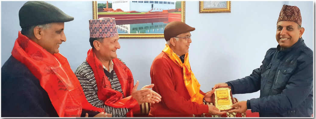 Dr. Tilak Ram Acharya receiving token of appreciation at felicitation ceremony Nepal